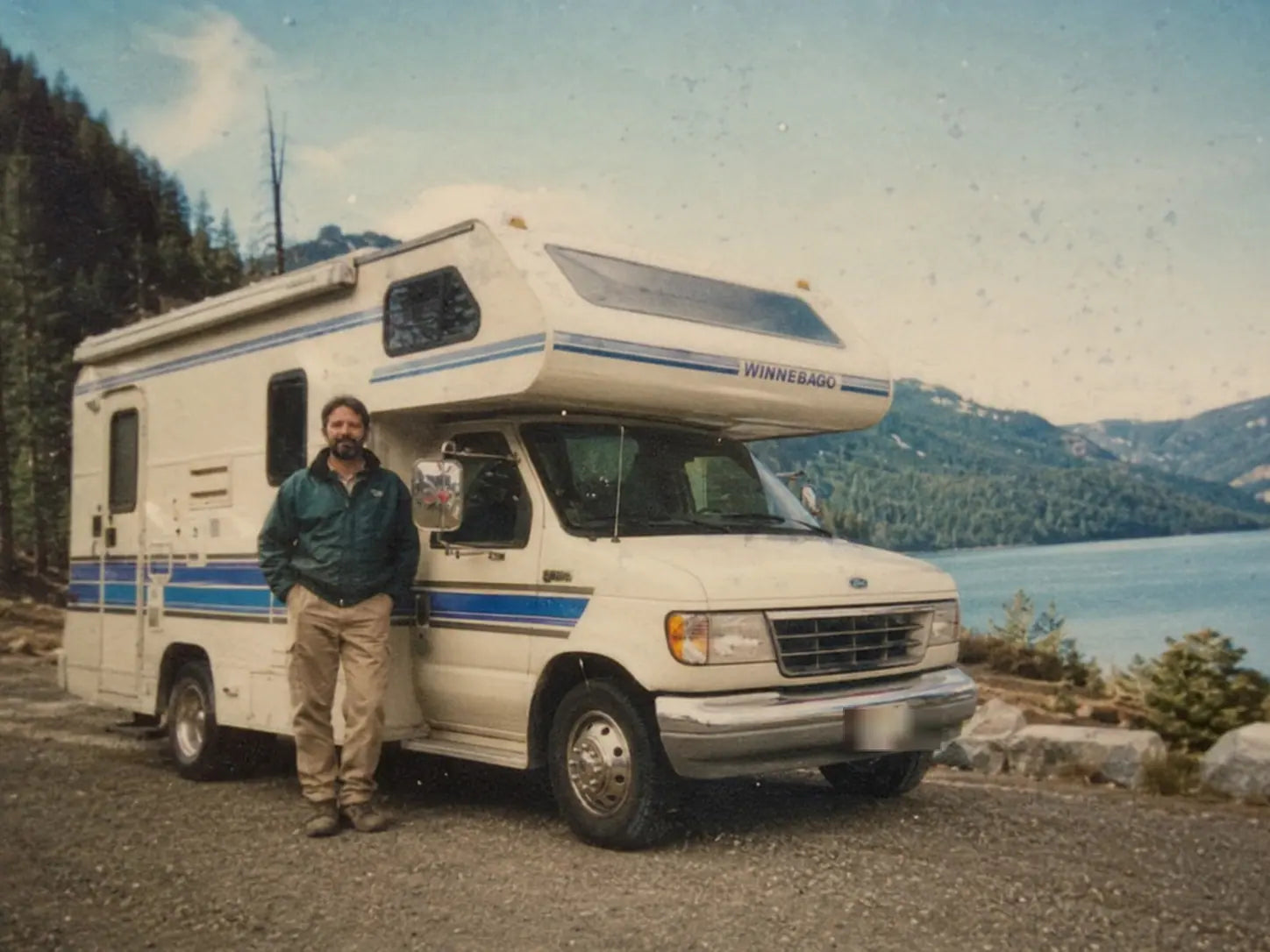 The founder standing beside his first RV